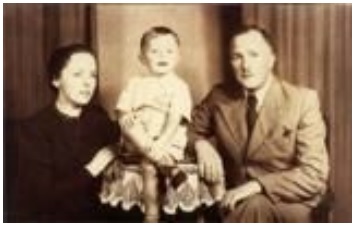 Old photo of George with parents