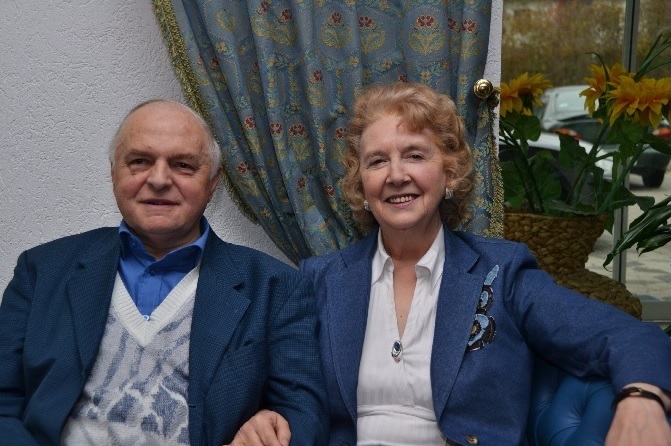George and Helen Jesze on sofa in conservatory