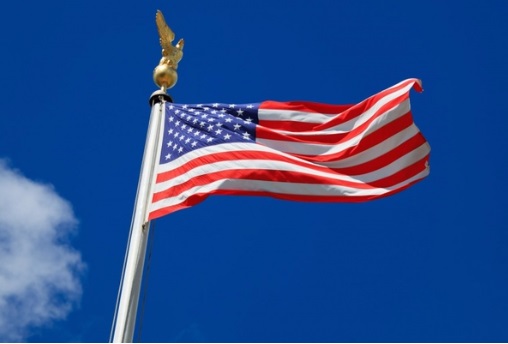 Stars and Stripes flies against blue sky